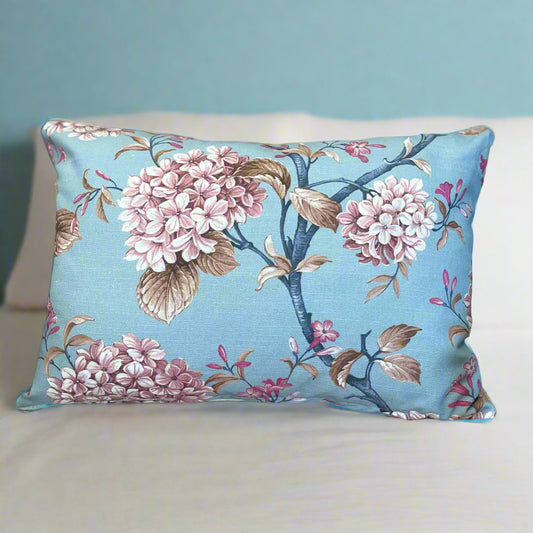 Floral-patterned pillow on a beige chair